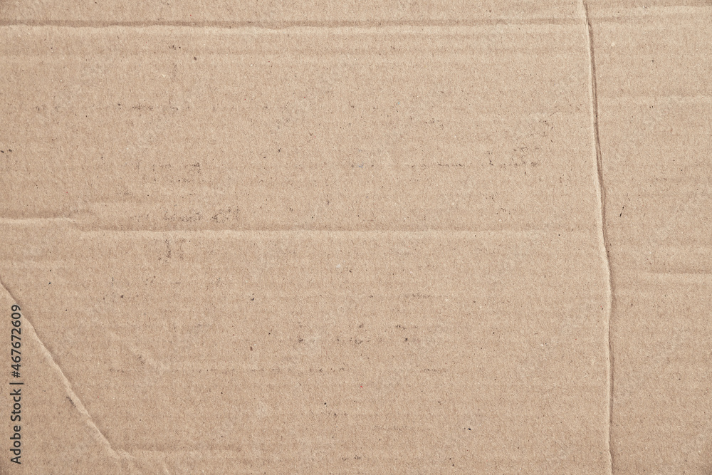 Fototapeta premium Rustic brown paperboard. Rough cardboard kraft texture