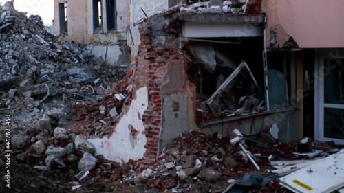 ruined house with empty windows, broken brick, cracks on the wall of a dilapidated building, the concept of ruin of people, business collapse due to Social problems, poverty, Low income, Urban decay photo