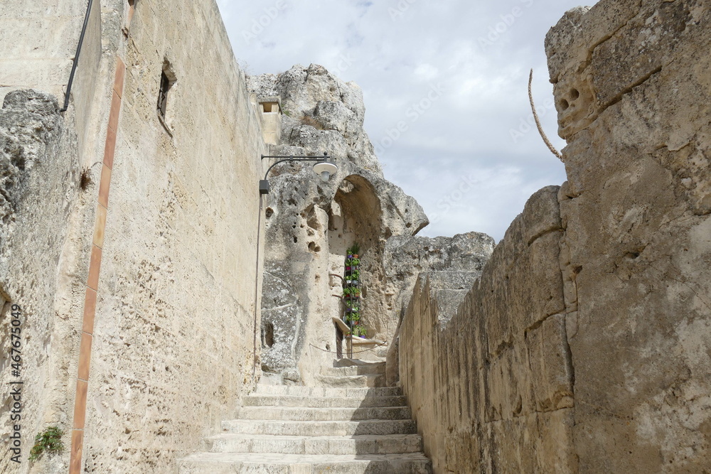 Typical stepped street between the historical buildings to Santa Maria di idris rupestrian church in Sasso Caveoso of Matera