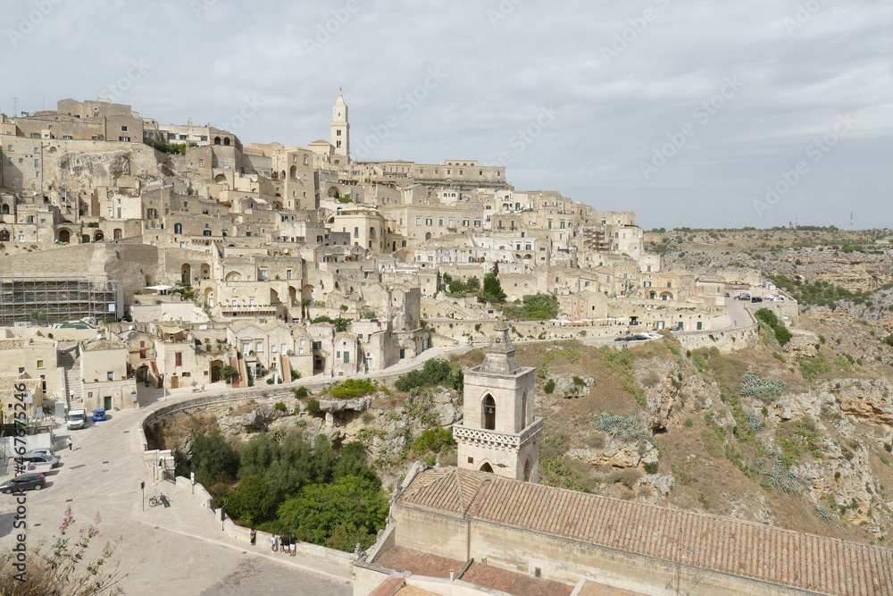 Obraz premium Panorama of Matera from Santa Maria di Idris viewpoint on Sasso Barisano, Civita and on the canyon carved by the Gravina River