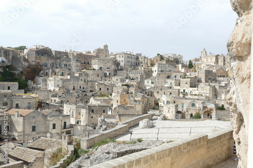 Fototapeta Naklejka Na Ścianę i Meble -  Panorama of Matera from Santa Maria di Idris viewpoint on Sasso Barisano, Civita and on the canyon carved by the Gravina River