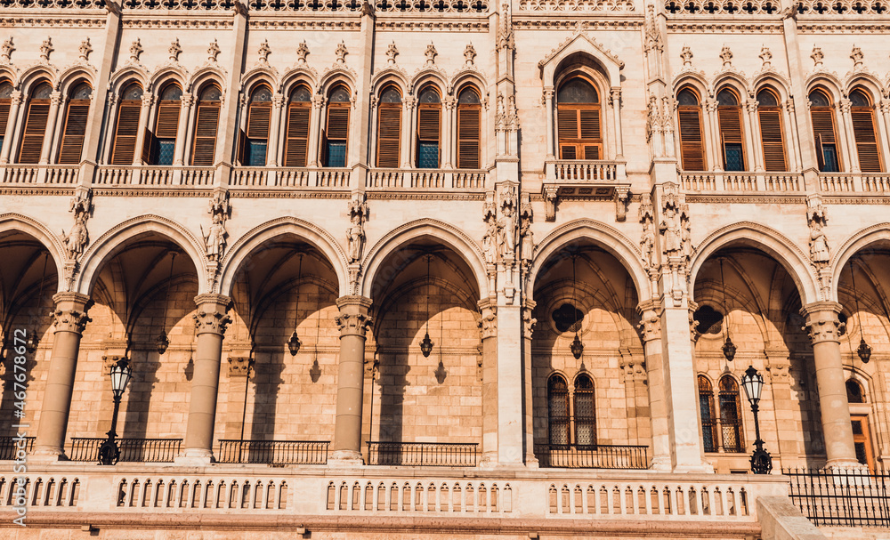 Hungarian Parliament building in Budapest at the daylight. 
Gothic architecture exterior. Tourist destination. Beautiful columns architecture details at the sunlight