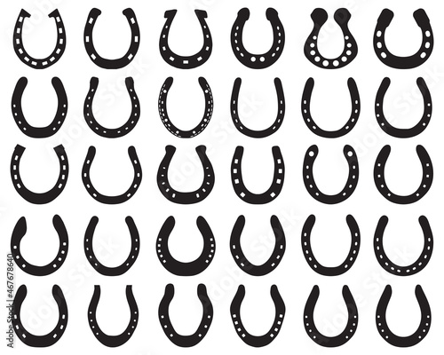Black silhouettes of horseshoes on a white background	