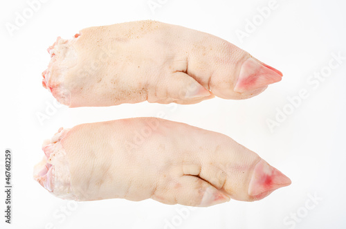 Two raw pork legs for cooking isolated on white background. Studio Photo
