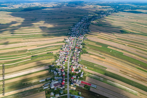 Obraz na płótnie Village, amazing in Poland from a bird's eye view from a drone. Sułoszowa - the longest village from the drone. w salonie