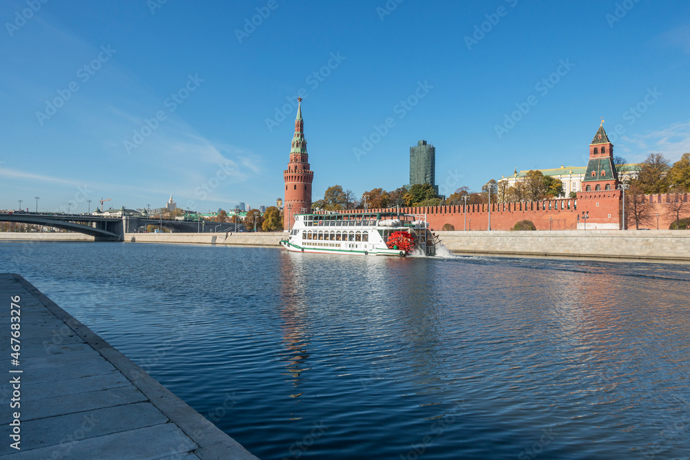 Motor ship on the Moskva river near the Kremlin embankment in Moscow an autumn day
