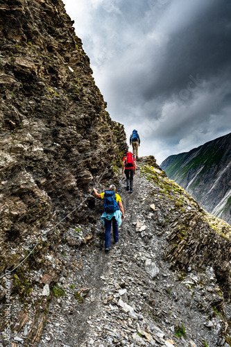 Group Of Hiking People On Via Ferrata Of Mountain Grossglockner In Austria