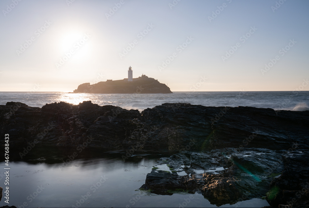 Godrevy lighthouse at sunset in Cornwall. United Kingdom