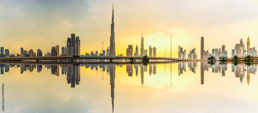 Skyline panorama of Dubai with reflection at sunset, UAE
