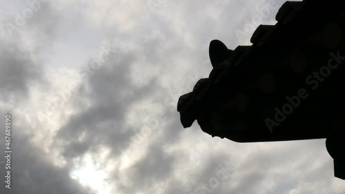 Slow cloud movment over the Korean architecture eaves silhouette