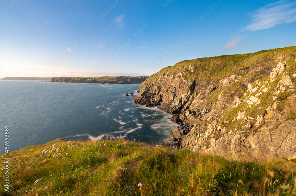 Love rock cliffs of Mullion Cove at sunset in Cornwall. United Kingdom