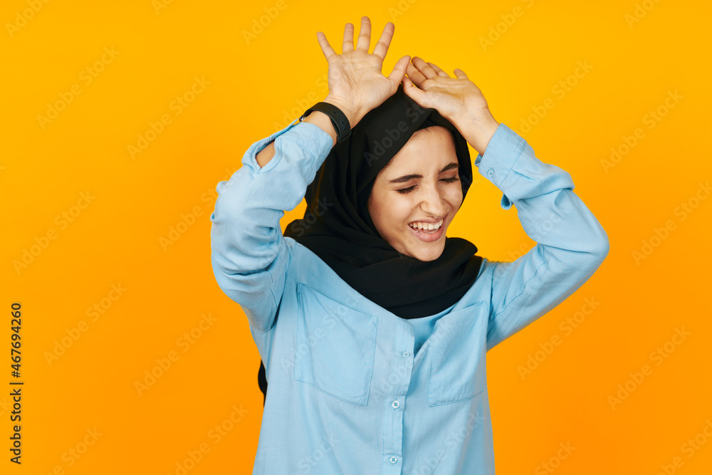 cheerful woman electronic clock entertainment technology yellow background cheerful woman electronic clock entertainment technology yellow background
