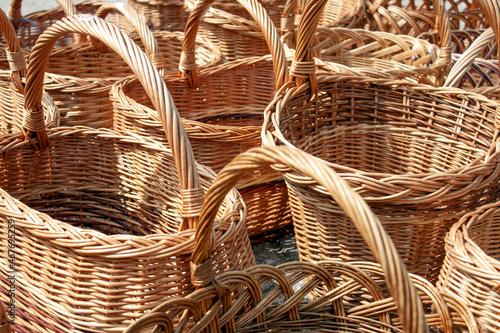 Wicker straw basket close-up. Handmade wicker baskets are sold in the market.