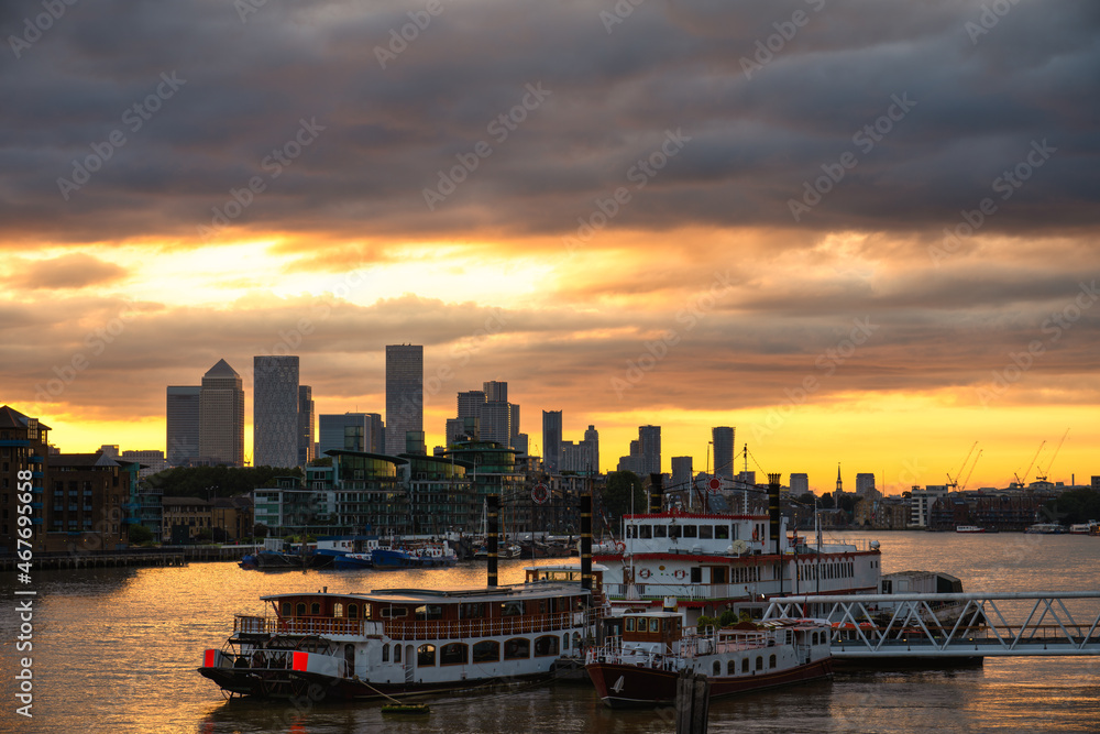 London skyline of river Thames overlooking Canary Wharf at sunrise. England London skyline of river Thames overlooking Canary Wharf at sunrise. England