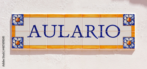 Aulario. Rótulo de azulejos de colores en la entrada del aula de naturaleza de un albergue rural. Letrero de aulario en idioma español photo