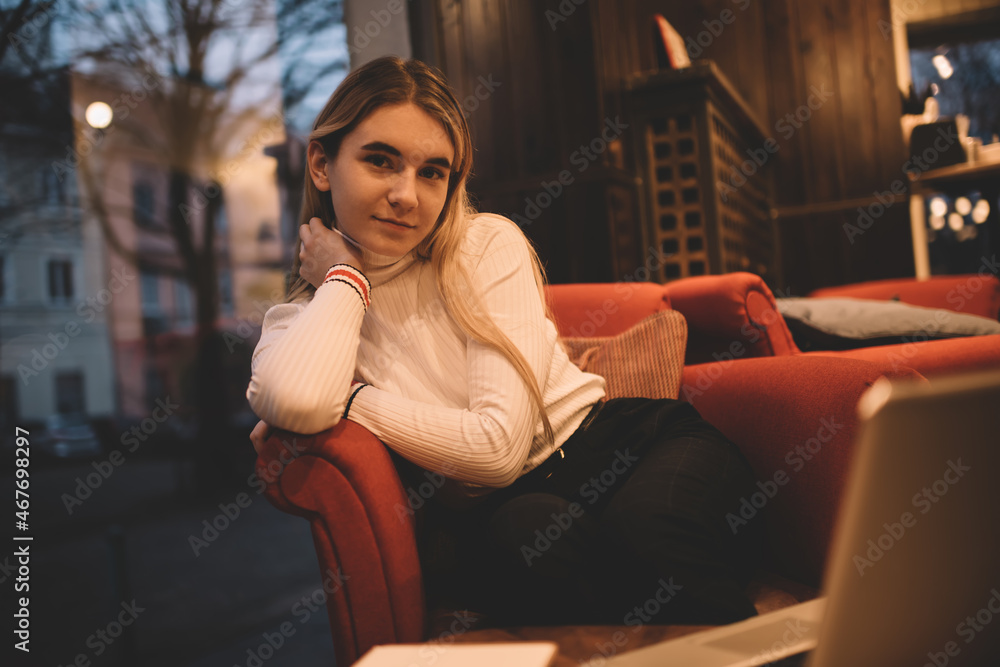 Fototapeta premium Calm woman resting in light cafe
