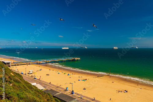 Boscombe beach and pier with cruise liners moored in Poole Bay photo