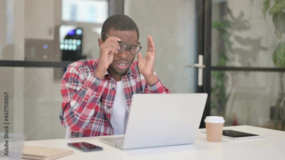 African Man Reacting to Loss While using Laptop African Man Reacting to Loss While using Laptop