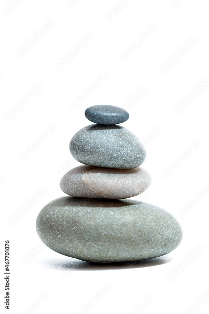 Balanced Zen stones on white background. Vertical photo Balanced Zen stones on white background. Vertical photo