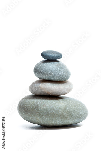 Balanced Zen stones on white background. Vertical photo