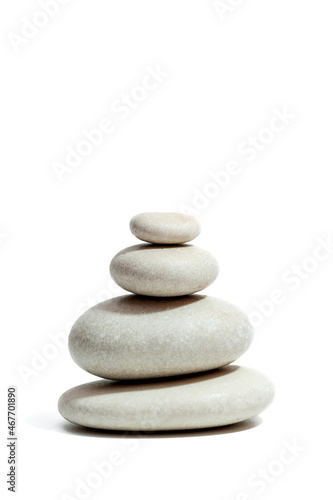 Zen stones pyramid isolated on white background. Vertical photo