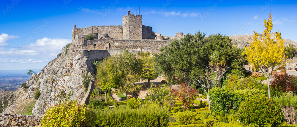 Panorama of the colorful garden in fall colors in front of the castle in Marvao, Portugal