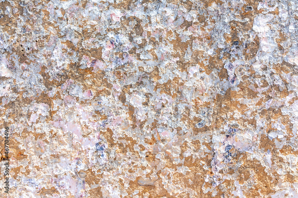 Obraz premium background of old plaster wall with peeling colors in white and orange