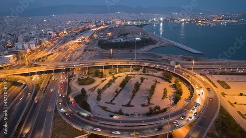 Aerial view of a big highway juction with traffic during dusk as seen in Athens, Greece photo