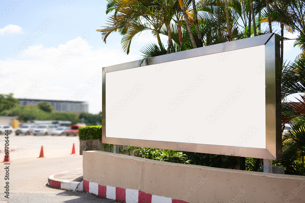 Fototapeta premium Mockup Large white blank billboard or white promotion poster displayed on the outdoor against. Promotion information for marketing announcements and details.