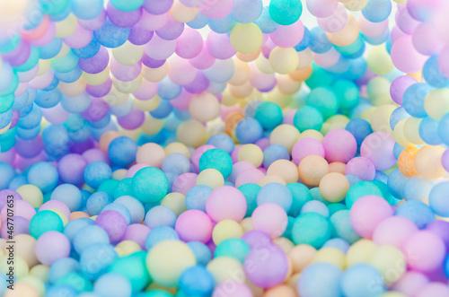 Foam beads of various colors brightly colored. © gamjai