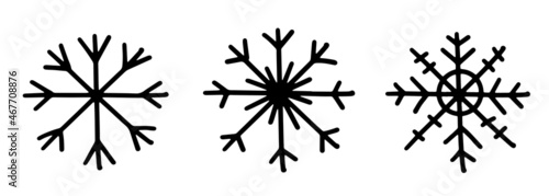 A set of three black different hand draw snowflake icons. Vector illustration isolated on background.