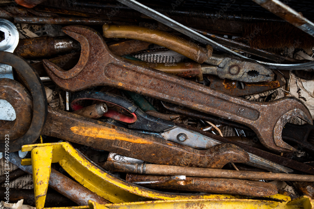 old rusty tools on wood background old rusty tools on wood background