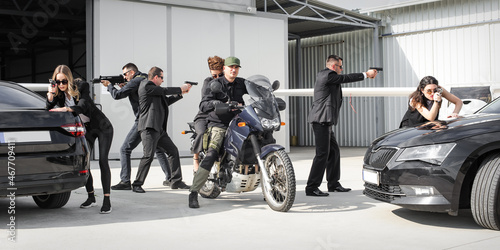 Tactical exercise training. An armed bodyguard security team protects celebrity