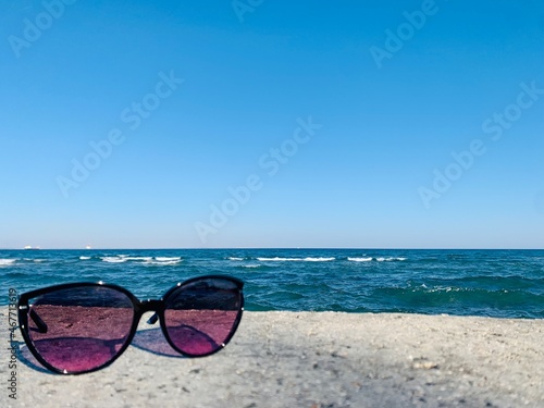 Wallpaper Mural sunglasses on the beach on sea background Torontodigital.ca
