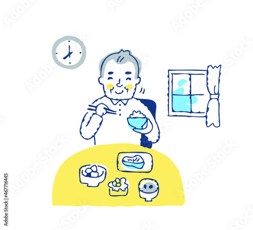 笑顔で朝食を食べるシニア男性