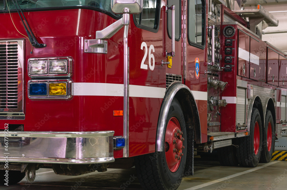 Fire truck with retractable ladder for extinguishing fires at height. A ...