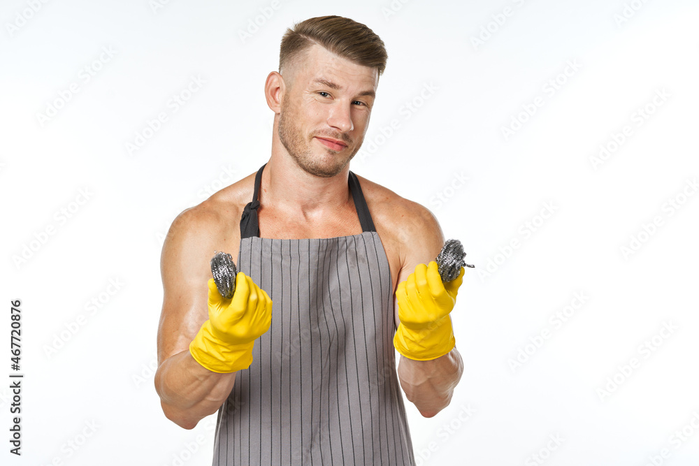 pumped up man in rubber gloves metal sponges close-up pumped up man in rubber gloves metal sponges close-up