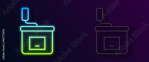 Glowing neon line Manual coffee grinder icon isolated on black background. Vector