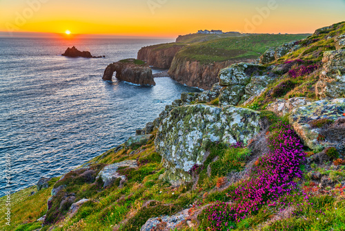Enys Dodman arch at sunset, Land's End, Cornwall photo
