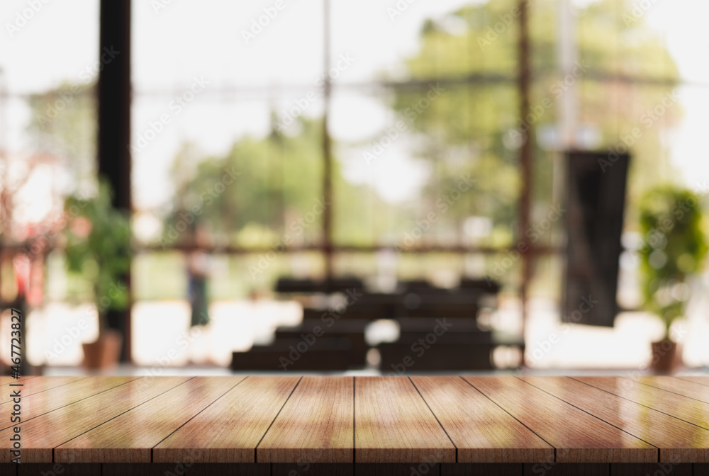 Empty wooden table top with lights bokeh on blur restaurant background. Empty wooden table top with lights bokeh on blur restaurant background.