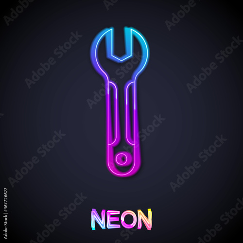 Glowing neon line Wrench spanner icon isolated on black background. Spanner repair tool. Service tool symbol. Vector