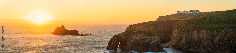 Land's End sunset panorama with Enys Dodman arch, Cornwall