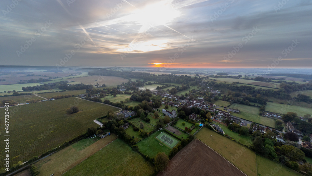 Misty autumn sunrise over the Hampshire village of Hambledon in the South Downs National Park