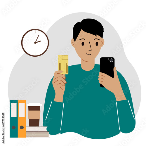 Online payment concept. A man holds a phone in one hand, a mobile phone in the other hand.