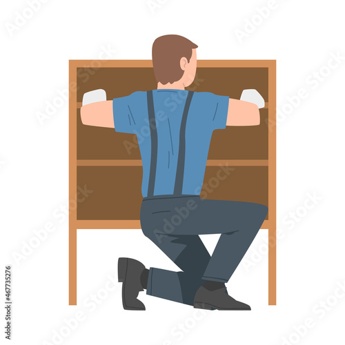 Young Man in Overall Assembling and Installing Wooden Furniture Vector Illustration