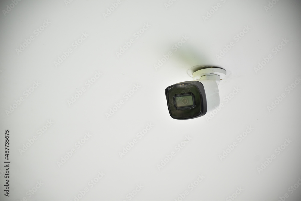 Wifi security camera or cctv camera installed on wall outside the house to do the security by monitoring of the house owner, soft and selective focus. Wifi security camera or cctv camera installed on wall outside the house to do the security by monitoring of the house owner, soft and selective focus.