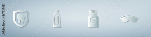 Set Dental protection, Tube of toothpaste, Toothache painkiller tablet and Safety goggle glasses. Paper art style. Vector