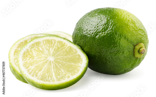 Lime whole and slices on a white background. Isolated