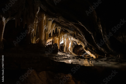 exploring underground caves with stalactite and stalagmite growth photo