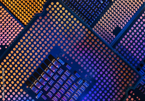 Macro close-up shot of a microchip, processor (CPU) concept of a high-tech control system for artificial intelligence on a board (PCB), central processing unit of a computer with components inside